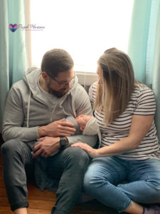 couple holding their baby | Purple Horizons
