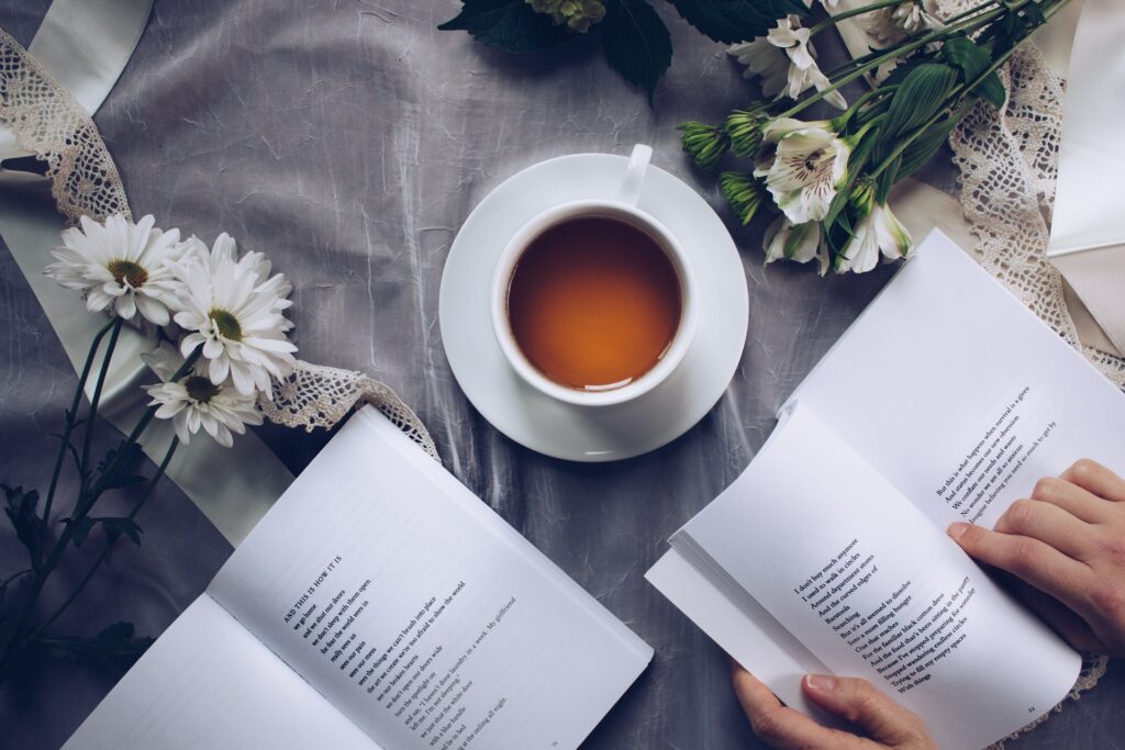 table with flowers, books, and coffee | Purple Horizons